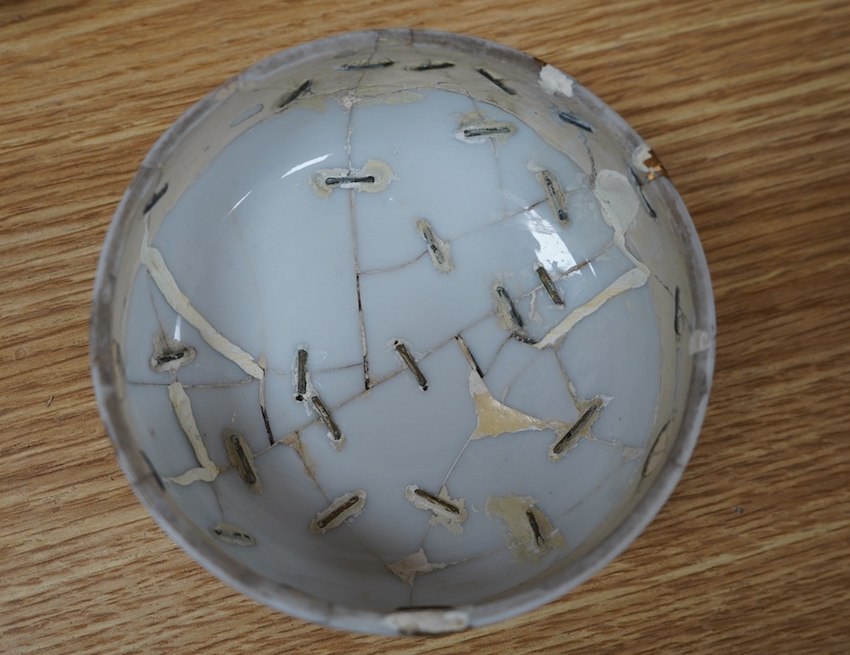 A Japanese Seto blue and white lidded ginger jar, 24cm high. Condition - lid poor (repaired in Kitsugi fashion with staples and filler visible to interior) body fair with one visible star crack.